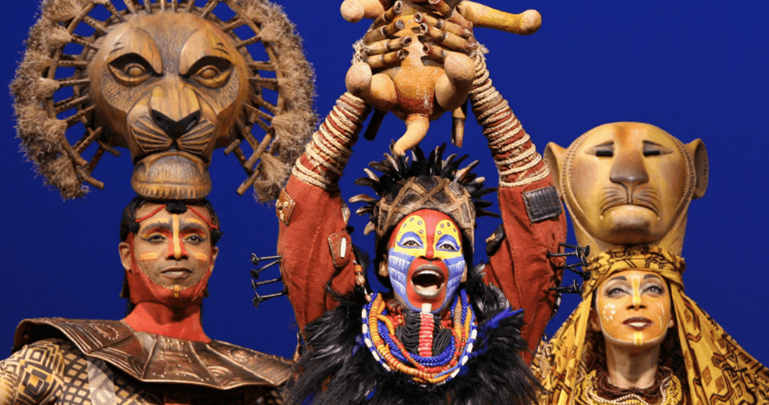 Rafiki holds up the lion cub Simba in The Lion King, a family favourite at the Lyceum Theatre
