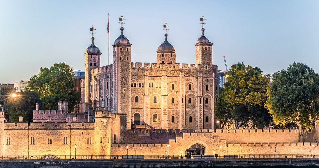 The Tower of London illuminated at dusk during an after-hours evening tour