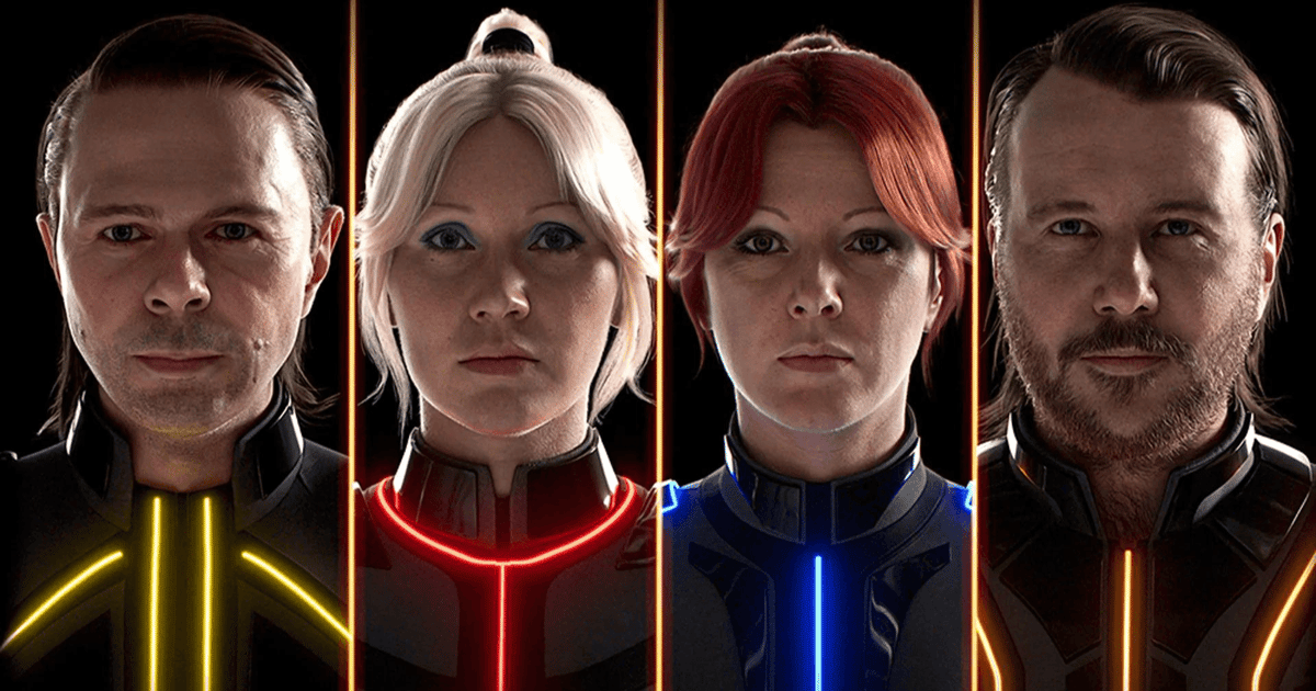 The four ABBA avatars in their illuminated Voyage costumes