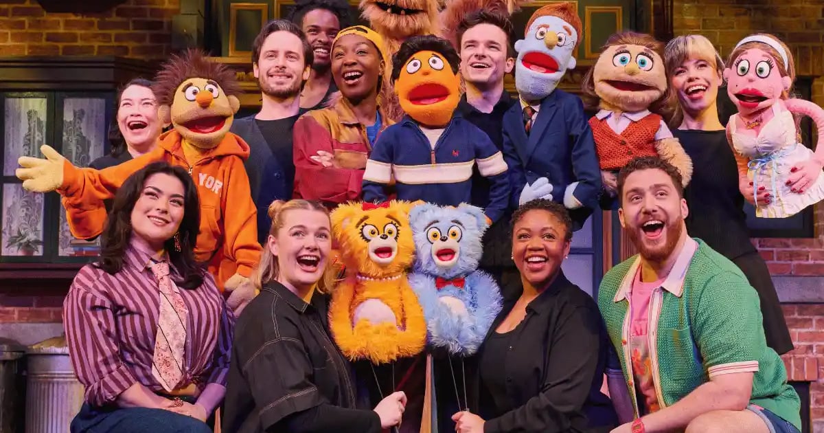 The 2026 London company of Avenue Q with their puppets at the Shaftesbury Theatre
