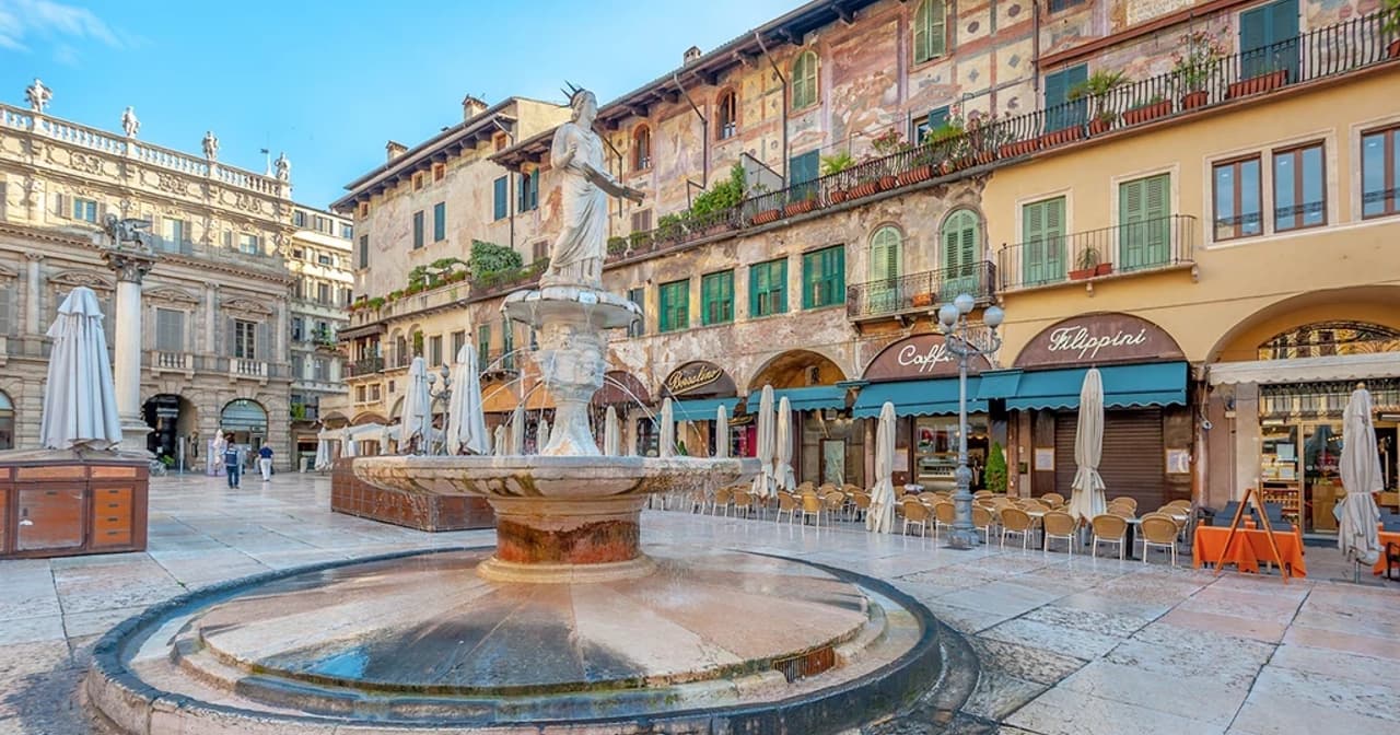 Piazza delle Erbe in Verona with its historic fountain and frescoed market square buildings