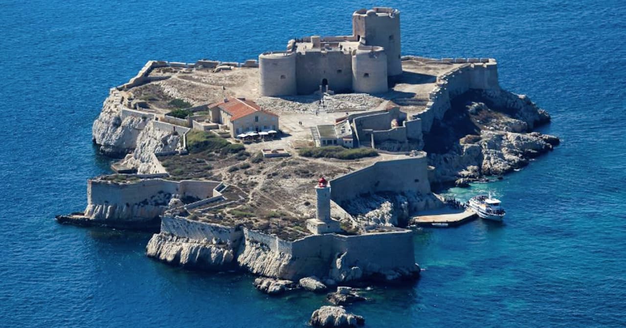Aerial view of the Chateau d'If island fortress in the blue sea off Marseille
