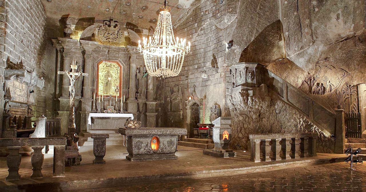 Underground salt chapel with chandelier and carved altar at Wieliczka near Krakow