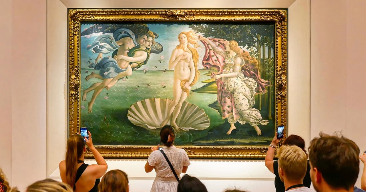 Visitors photographing Botticelli's Birth of Venus at the Uffizi Gallery in Florence
