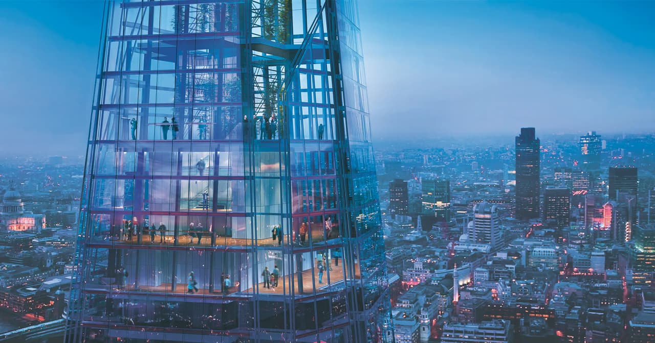 London skyline at golden hour from the Shard with the Thames curving past the City