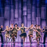 The company of The Great Gatsby dancing in 1920s costumes on Broadway