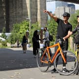 Cyclists by the Brooklyn Bridge in New York, the southern end of the Summer Streets route