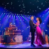 Sam Tutty and Christiani Pitts embrace amid falling confetti in Two Strangers (Carry a Cake Across New York)