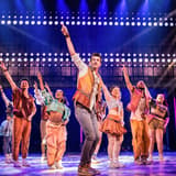 The full cast of & Juliet performing a concert-style number on Broadway