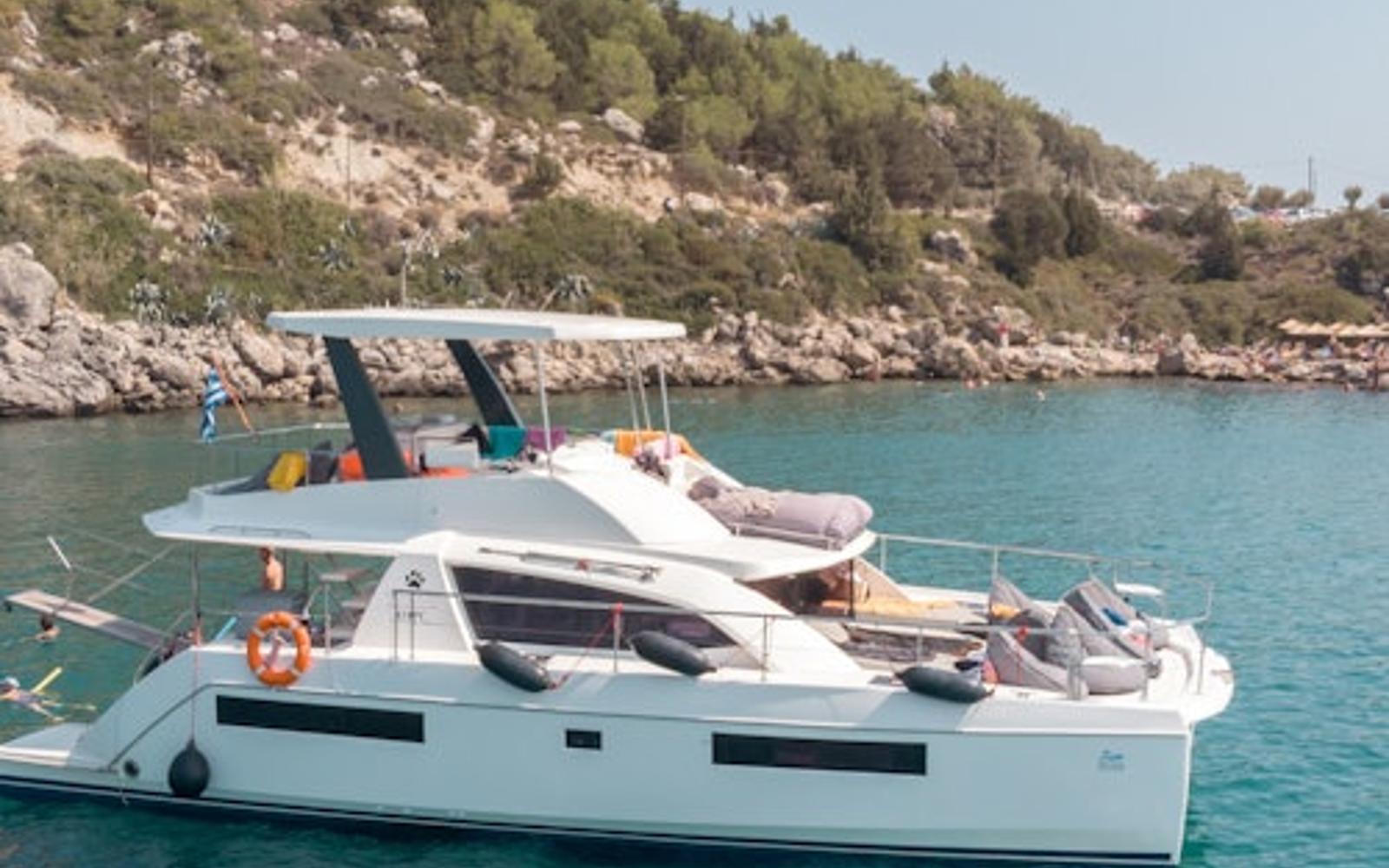Rhodes: Power Catamaran Day Cruise with Lunch