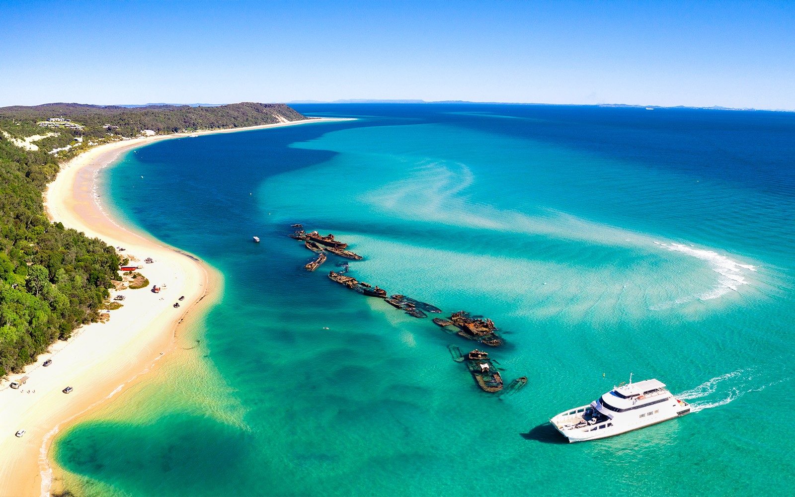 From Gold Coast: Tangalooma Wrecks Snorkel, Clear Kayak, & 4WD Desert Tour with Lunch