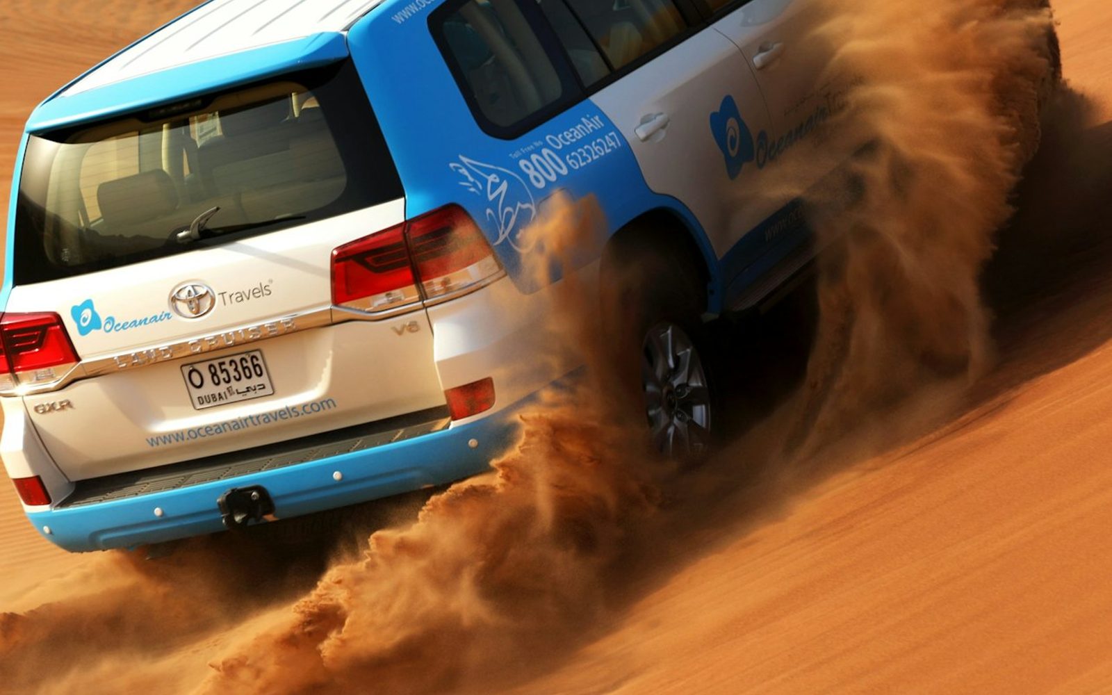 Morning Desert Safari: Dune Bashing, Sandboarding and Camel Rides