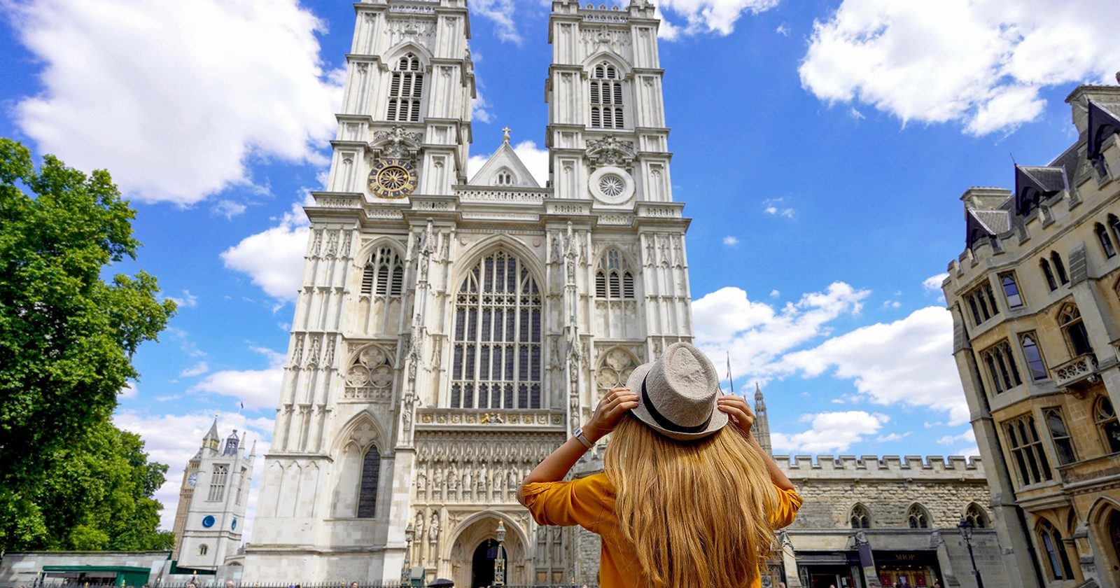 Westminster Abbey facade with visitor during 3-hour walking tour, London.