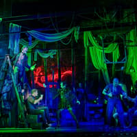 Stage performance of Moulin Rouge! The Musical in West End with actors in vibrant costumes