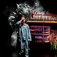 Man in pajamas near Henderson Liquors sign, couple embracing, Stranger Things: The First Shadow