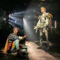 Actors performing in a forest scene from "Into The Woods" production