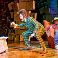 Matilda The Musical scene with characters interacting on stage