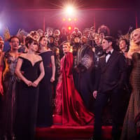 Stage performance of The Devil Wears Prada West End show with cast in elaborate costumes