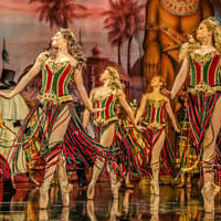 Dancers in colorful costumes perform on stage during Phantom of the Opera production — The Phantom of the Opera