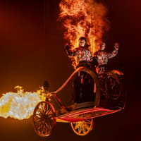 Performers in fiery costumes on stage during Hunger Games West End show — The Hunger Games