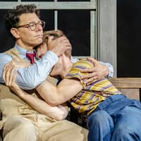 Actors embrace on stage during "To Kill a Mockingbird" West End show