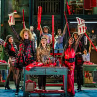 Performers on stage during a vibrant scene from the Kinky Boots musical production