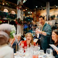 Guests enjoying dinner and entertainment at Mamma Mia! The Party event