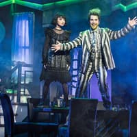 Stage scene from Beetlejuice West End with characters in dramatic poses