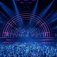 Crowd enjoying ABBA Voyage concert with vibrant stage lights in London — Tickets to ABBA Voyage Concert with Express Coach Round-Trip Transfers from London