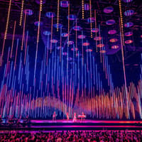 ABBA Voyage concert stage with colorful light display in London — Tickets to ABBA Voyage Concert with Express Coach Round-Trip Transfers from London