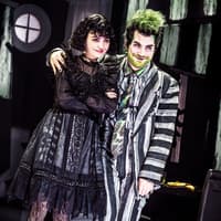 Stage performance of Beetlejuice in West End with two actors in costume