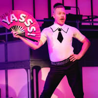 Performer on stage with a fan during Titanique Westend show