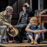 Actors performing a scene from "To Kill a Mockingbird" on a West End stage