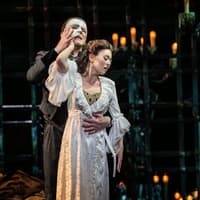 The Phantom and Christine in a candlelit embrace, The Phantom of the Opera. Photo by Johan Persson