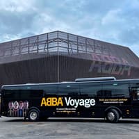 ABBA Voyage concert coach outside ABBA Arena, London — Tickets to ABBA Voyage Concert with Express Coach Round-Trip Transfers from London