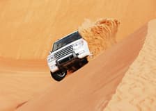 Doha Desert Safari with Camel Ride: Dune Bashing, Sandboarding & Inland Sea