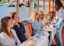 Amsterdam: 1-Hour Luxury Heated Saloon Boat Cruise with Unlimited Drinks & Cheese