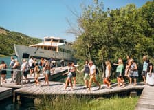 From Split: Full-Day Guided Trip to Krka National Park with Boat Ride & Wine Tasting