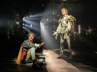 Actors performing in a forest scene from "Into The Woods" production