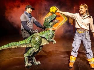 Dinosaur puppet performance at Dinosaur World Live, West End stage