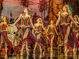 Dancers in colorful costumes perform on stage during Phantom of the Opera production — The Phantom of the Opera