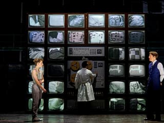 Control room scene from Stranger Things: The First Shadow with characters and vintage monitors
