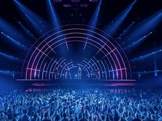 Crowd enjoying ABBA Voyage concert with vibrant stage lights in London — Tickets to ABBA Voyage Concert with Express Coach Round-Trip Transfers from London