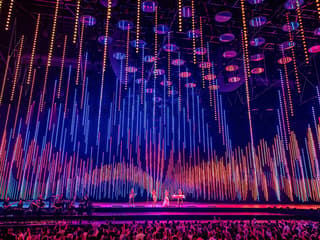 ABBA Voyage concert stage with colorful light display in London — Tickets to ABBA Voyage Concert with Express Coach Round-Trip Transfers from London