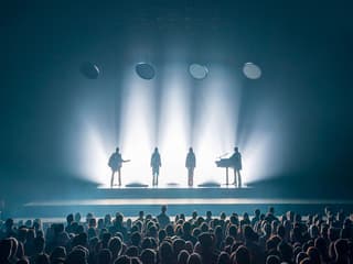 ABBA Voyage concert stage with band silhouettes and audience in London — Tickets to ABBA Voyage Concert with Express Coach Round-Trip Transfers from London