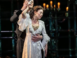 The Phantom and Christine in a candlelit embrace, The Phantom of the Opera. Photo by Johan Persson