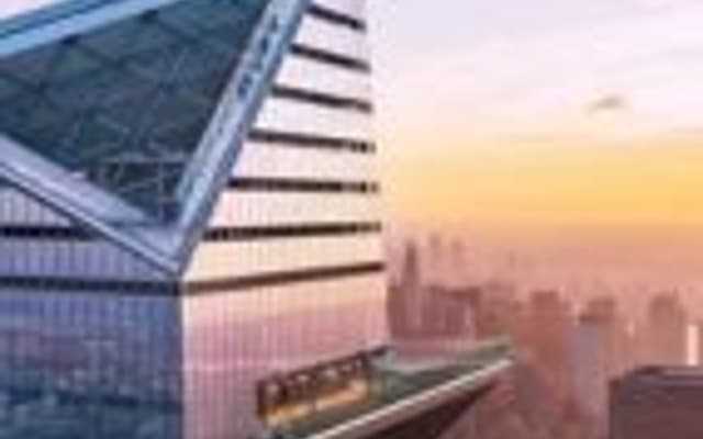 Angular glass observation deck of a New York skyscraper at sunset above the Manhattan skyline