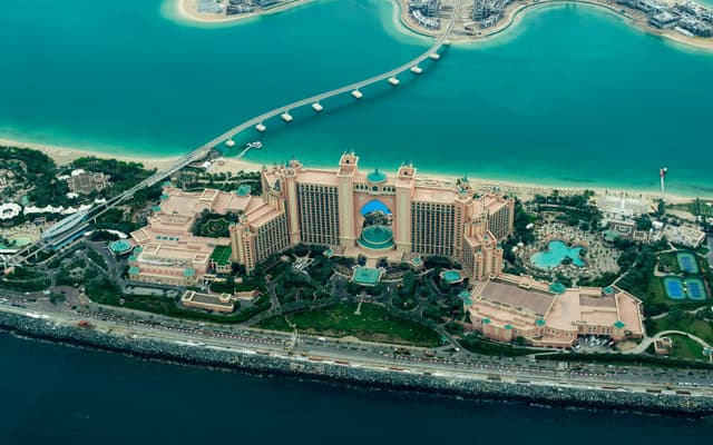 Aerial view of Atlantis The Palm resort on Palm Jumeirah in Dubai by turquoise sea