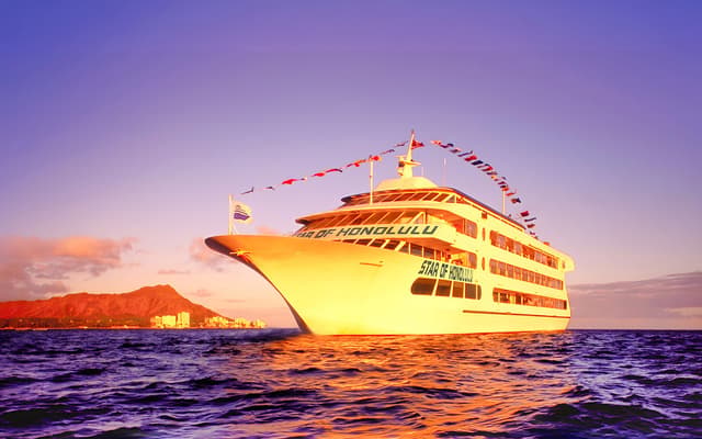Star of Honolulu cruise ship at sunset with Diamond Head behind on the Hawaiian coast