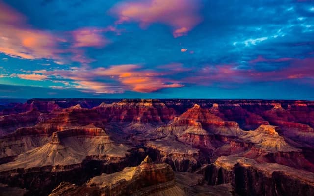 Dramatic desert canyon glowing red under a pink and blue sunset sky near Las Vegas